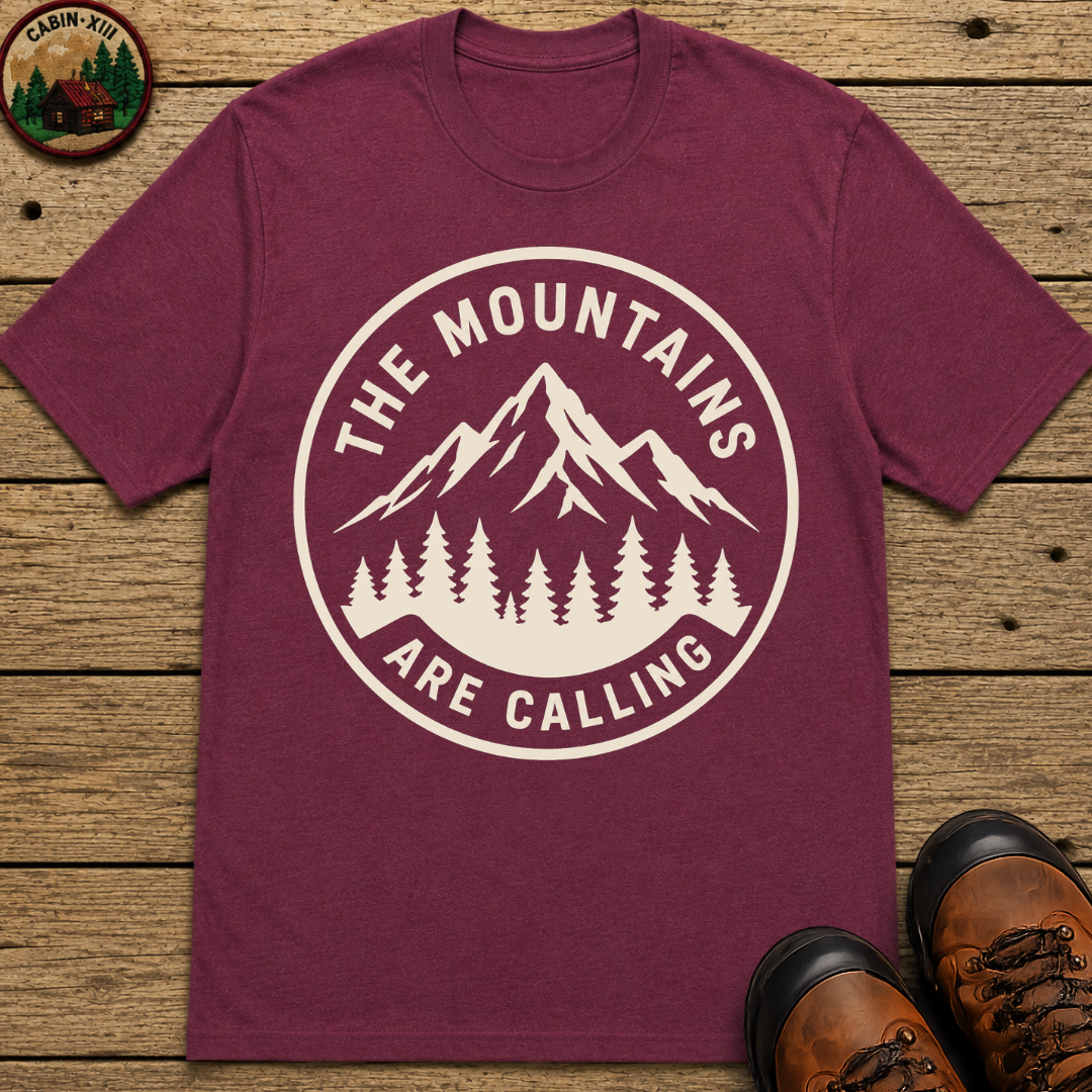 The Mountains Are Calling — Vintage Hiking Outdoor Badge Tee