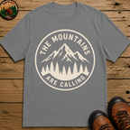 The Mountains Are Calling — Vintage Hiking Outdoor Badge Tee