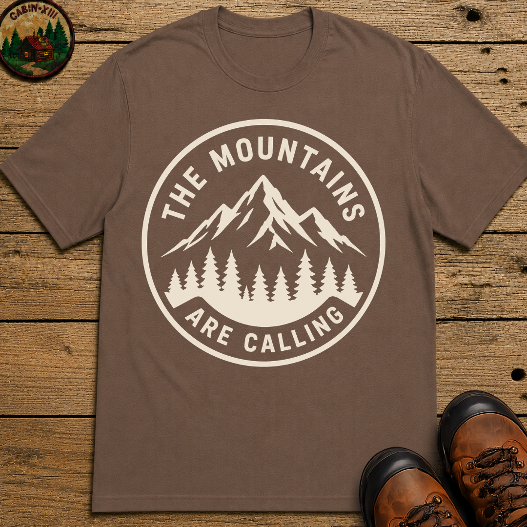 The Mountains Are Calling — Vintage Hiking Outdoor Badge Tee