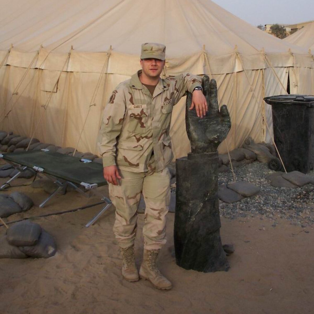 Brian, the founder, in uniform outside a tent in Iraq, 2003
